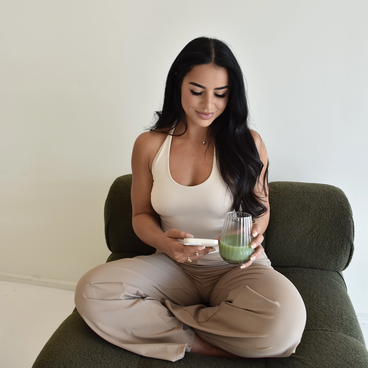 Elif posting to Instagram while drinking a healthy juice